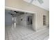 Spacious living area with tile floors and an open layout, perfect for entertaining at 2726 La Alameda Ave, Kissimmee, FL 34746