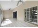 Open-concept living area with lots of natural light and tiled flooring at 2726 La Alameda Ave, Kissimmee, FL 34746