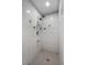 This is a tiled stand up shower with adjustable head at 2726 La Alameda Ave, Kissimmee, FL 34746