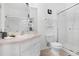 Clean bathroom featuring a shower with glass door, ample counter space, and bright lighting at 2785 Almaton Loop # 202, Kissimmee, FL 34747