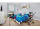 Bright bedroom with twin beds, cheerful decor, and natural light at 2785 Almaton Loop # 202, Kissimmee, FL 34747