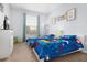 Cozy bedroom featuring two twin beds, bright colors, and playful decor at 2785 Almaton Loop # 202, Kissimmee, FL 34747