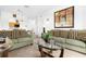Bright living room with comfortable seating, stylish decor, and seamless flow to adjacent rooms at 2785 Almaton Loop # 202, Kissimmee, FL 34747