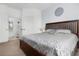 Serene main bedroom featuring neutral tones, comfortable bedding, and an attached bathroom at 2785 Almaton Loop # 202, Kissimmee, FL 34747