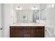 Elegant bathroom with double vanity, white countertops, and a large mirror at 3128 Oxbow Ct, Harmony, FL 34773