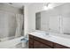 Bathroom featuring a shower/tub and a vanity with a large mirror at 3128 Oxbow Ct, Harmony, FL 34773