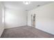 Comfortable bedroom with soft carpeting, neutral paint, and a spacious closet at 3128 Oxbow Ct, Harmony, FL 34773