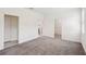 Spacious bedroom featuring soft carpeting, walk-in closet, and a doorway to an attached bathroom at 3128 Oxbow Ct, Harmony, FL 34773