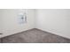Bedroom features neutral carpet, white walls and baseboards, and a window at 3128 Oxbow Ct, Harmony, FL 34773