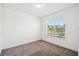 Bright bedroom features neutral carpet, white walls and baseboards, and a large window at 3128 Oxbow Ct, Harmony, FL 34773