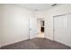 Bedroom with neutral carpet and large closet with sliding doors at 3128 Oxbow Ct, Harmony, FL 34773