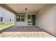 Relax on this brick-paved covered patio with views of the backyard and convenient access to the home at 3128 Oxbow Ct, Harmony, FL 34773