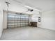 Two car garage with roll-up door and plenty of space for storage at 3128 Oxbow Ct, Harmony, FL 34773