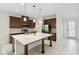 A well-equipped kitchen with a large island, stainless steel appliances, and ample cabinet space at 3128 Oxbow Ct, Harmony, FL 34773