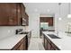 Modern kitchen featuring quartz countertops, stainless steel appliances, and ample storage at 3128 Oxbow Ct, Harmony, FL 34773