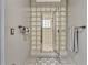 Elegant bathroom featuring a glass block shower enclosure and updated fixtures and ample space at 3359 Scarlet Dr, Sanford, FL 32773