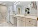 Bright bathroom featuring a double vanity, ample storage, and neutral tile flooring at 3359 Scarlet Dr, Sanford, FL 32773