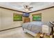 Comfortable bedroom with natural light, ceiling fan, and calming neutral color scheme at 3359 Scarlet Dr, Sanford, FL 32773