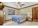 Comfortable bedroom with neutral carpet, ceiling fan, and calming neutral color scheme at 3359 Scarlet Dr, Sanford, FL 32773