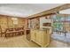 View of the dining room adjacent to the kitchen with wood accents and a decorative beam at 3359 Scarlet Dr, Sanford, FL 32773