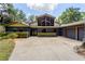 Charming home featuring a large, bright window, mature trees, and a spacious driveway at 3359 Scarlet Dr, Sanford, FL 32773