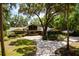 Stunning single-story home with mature trees, inviting driveway, and lush landscaping create curb appeal at 3359 Scarlet Dr, Sanford, FL 32773