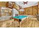 Spacious game room with fireplace, pool table, spiral staircase, and wood accents at 3359 Scarlet Dr, Sanford, FL 32773