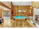 Game room with a pool table, fireplace, and access to the pool area at 3359 Scarlet Dr, Sanford, FL 32773