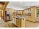 Beautiful kitchen featuring custom cabinets, stainless appliances, and a center island with a marble countertop at 3359 Scarlet Dr, Sanford, FL 32773