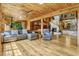 Spacious living room featuring an open floor plan, fireplace, spiral staircase and hardwood floors at 3359 Scarlet Dr, Sanford, FL 32773