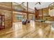 Open concept living room featuring a pool table, fireplace, and wood-paneled walls at 3359 Scarlet Dr, Sanford, FL 32773