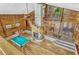 Spacious living room boasts wood paneling, spiral staircase, and pool table for ultimate entertainment and relaxation at 3359 Scarlet Dr, Sanford, FL 32773