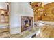 Cozy living room with a unique fireplace, spiral staircase, and warm wood accents at 3359 Scarlet Dr, Sanford, FL 32773