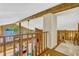 Loft overlooking open floorplan with views of lake through expansive windows at 3359 Scarlet Dr, Sanford, FL 32773