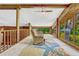 Cozy loft features water views through expansive windows and wood paneled walls at 3359 Scarlet Dr, Sanford, FL 32773