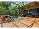 Beautiful screened-in pool area boasts lush landscaping and a charming rock waterfall feature, ideal for relaxing at 3359 Scarlet Dr, Sanford, FL 32773