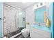 Modern bathroom with glass shower, unique blue sink, and decorative tile work at 4051 Eagle Feather Dr, Orlando, FL 32829