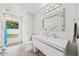 Well-lit bathroom featuring a modern vanity, sleek fixtures, and a mirror at 4051 Eagle Feather Dr, Orlando, FL 32829