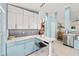 Well-lit kitchen with stainless steel appliances, modern cabinets, pendant lighting, and eat in breakfast nook at 4051 Eagle Feather Dr, Orlando, FL 32829
