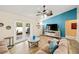 Inviting living room with light-colored wood floors, a ceiling fan and sliding doors to the outside at 4051 Eagle Feather Dr, Orlando, FL 32829