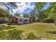 Backyard view of a single-story house and small deck at 47730 State Road 19, Altoona, FL 32702