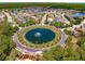 Gorgeous aerial view of a lush community featuring multiple ponds, mature trees, and well-maintained homes in a desirable neighborhood at 5062 Otters Den Trl, Sanford, FL 32771