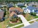 Aerial view of a home with a brown roof and meticulously landscaped front yard at 5062 Otters Den Trl, Sanford, FL 32771