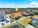 Desirable backyard featuring a sprawling green lawn, privacy fence, mature trees, and a screened-in pool perfect for outdoor enjoyment at 5062 Otters Den Trl, Sanford, FL 32771