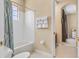 Cozy bathroom featuring a shower-tub combo and ample towel racks, providing convenience and functionality for everyday use at 5062 Otters Den Trl, Sanford, FL 32771