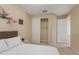Bedroom showcasing a closet and a door leading to the en suite bathroom and neutral walls at 5062 Otters Den Trl, Sanford, FL 32771
