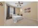 Inviting bedroom with soft lighting and soothing color palette, creating a cozy and tranquil retreat for relaxation at 5062 Otters Den Trl, Sanford, FL 32771