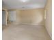 Large bonus room with neutral walls and carpet features a closet and multiple electrical outlets at 5062 Otters Den Trl, Sanford, FL 32771