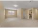 Large bonus room features neutral walls, carpet, and doorways that lead to other rooms in the house at 5062 Otters Den Trl, Sanford, FL 32771