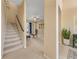 Hallway with a staircase leading to the second floor and views of the living room at 5062 Otters Den Trl, Sanford, FL 32771